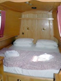 King sized double bed in its own private bedroom.